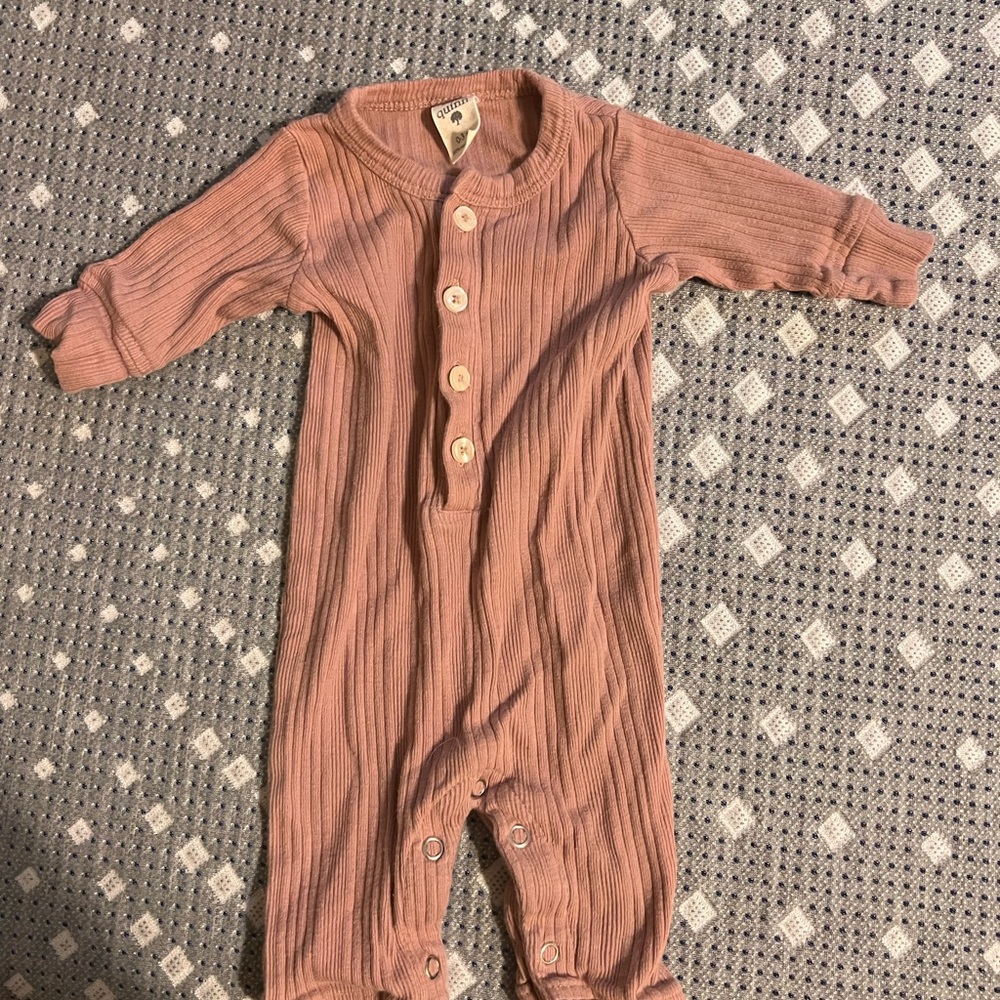 Kate Quinn pinkish One Piece outfit